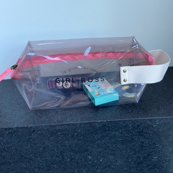 NWOT Benefit clear cosmetic pouch with 24 samples
